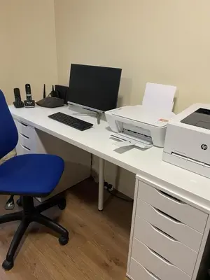 an office with a desk with a laptop and a printer at The class omote in Tokyo