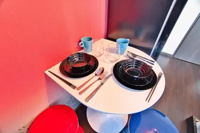 a white table with two plates and glasses on it at Ikebukuro 10min Kanamecho 9min Max 2 NVF101 in Tokyo