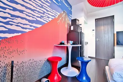 a room with two red and blue stools and a table at Ikebukuro 10min Kanamecho 9min Max 2 NVF101 in Tokyo