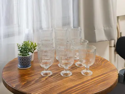 a group of wine glasses sitting on a wooden table at Shibuya, 3min walk Ebisu Sta, 2min Harajuku Sta,Queen bed in Tokyo