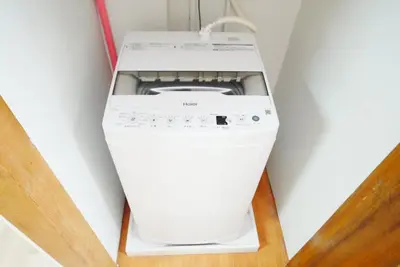 a white washer and dryer in a room at Ikebukuro Base in Tokyo