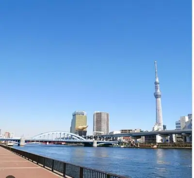a view of a river with a bridge and a city at jtr\u6d45\u8349\u6a4b401 in Tokyo