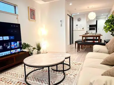 a living room with a couch and a table at \u843d\u5408\u30df\u30ea\u30aa\u30f3\u30cf\u30a6\u30b9 in Tokyo