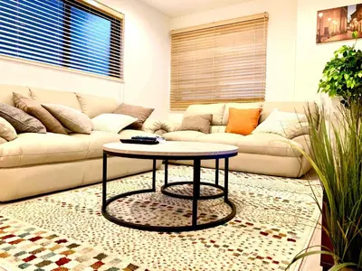 a living room with a couch and a table at \u843d\u5408\u30df\u30ea\u30aa\u30f3\u30cf\u30a6\u30b9 in Tokyo