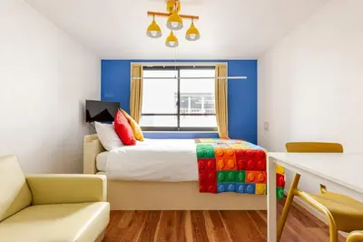 a bedroom with a bed and a window at jtr\u6d45\u8349\u6a4b402 in Tokyo