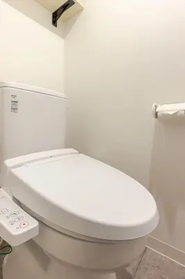 a bathroom with a white toilet in a room at jtr\u6d45\u8349\u6a4b402 in Tokyo