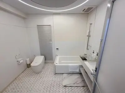 a white bathroom with a toilet and a sink at Reimi Mondo703 in Tokyo