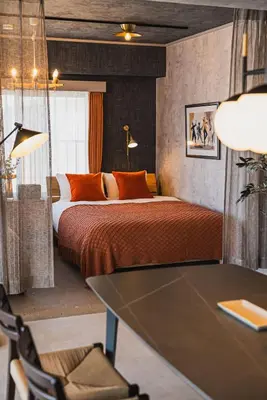 a bedroom with a bed and a table in it at Luxury Stay near Azabudai Hills and Tokyo Tower, 2-Bedroom Apartment in Tokyo