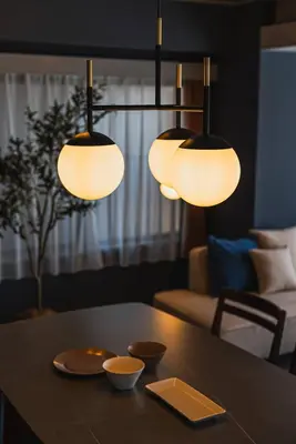 a table with three lights on top of it at Luxury Stay near Azabudai Hills and Tokyo Tower, 2-Bedroom Apartment in Tokyo