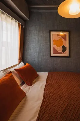 a bedroom with a large bed with a window at Luxury Stay near Azabudai Hills and Tokyo Tower, 2-Bedroom Apartment in Tokyo
