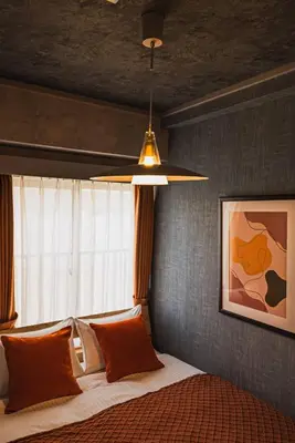 a bedroom with a bed with a window and a ceiling at Luxury Stay near Azabudai Hills and Tokyo Tower, 2-Bedroom Apartment in Tokyo