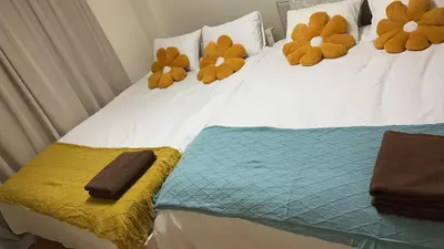 two beds with stuffed teddy bears on top of them at 21\u89c2\u666f\u9633\u53f0\u623f \u5927\u7a7a\u95f4\u536b\u6d74\u53a8\u623f \u6d17\u8863\u673a \u8f66\u7ad9\u6b65\u884c3\u5206\u949f \u4e0a\u91ce \u6d89\u8c37 \u8fea\u58eb\u5c3c \u673a\u573a \u5750\u8f66\u76f4\u8fbe in Tokyo