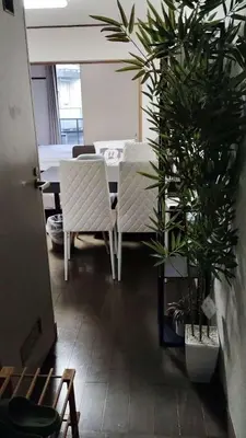 a dining room with a table and chairs and plants at 22\u89c2\u666f\u9633\u53f0\u623f \u5927\u7a7a\u95f4\u536b\u6d74\u53a8\u623f \u6d17\u8863\u673a \u8f66\u7ad9\u6b65\u884c3\u5206\u949f \u4e0a\u91ce \u6d89\u8c37 \u8fea\u58eb\u5c3c \u673a\u573a \u5750\u8f66\u76f4\u8fbe in Tokyo