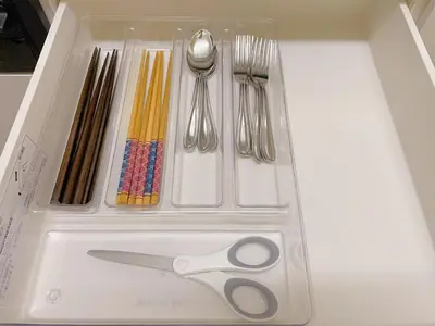 a white box with scissors and utensils in it at \u53cb\u7e01\u306e\u5bb6Destined Bonds Haven\u5317\u5343\u4f4f in Tokyo