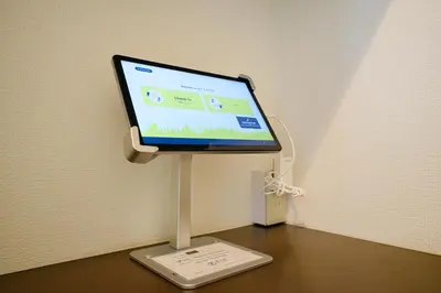 a computer monitor on a stand on a desk at \u3055\u304f\u3089\u30cf\u30a6\u30b9 - Sakura house - \u5e83\u3005\u5feb\u9069 \u6700\u59276\u540d\u6ede\u5728\u53ef in Tokyo