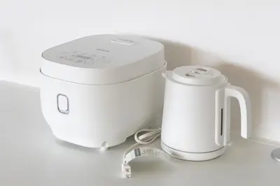 a white food processor and a tea kettle on a counter at SLEEPLAB \u795e\u697d\u5742 -Kagurazaka- in Tokyo