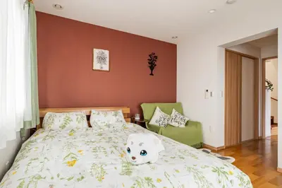 a bedroom with a bed with a teddy bear on it at hotel fleur-3F in Tokyo