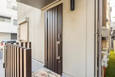 a door of a building with a rug in front of it at hotel fleur-3F in Tokyo