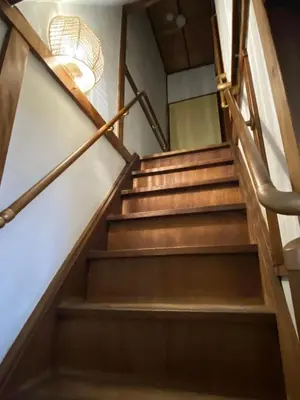 a set of stairs in a building with a chandelier at \u4ec1\u6e90\u548c in Tokyo