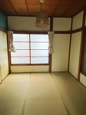 an empty room with a large window in a building at \u4ec1\u6e90\u548c in Tokyo
