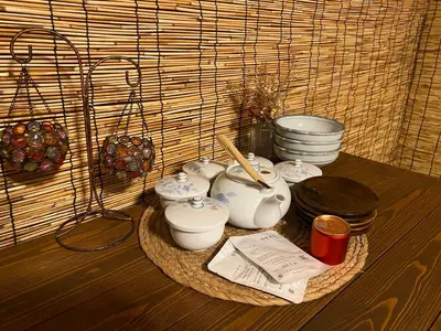a table with a bunch of pots and pans at \u4ec1\u6e90\u548c in Tokyo