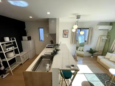 a kitchen and living room with a sink and a couch at jtr\u58a8\u75303\u4e01\u76ee in Tokyo