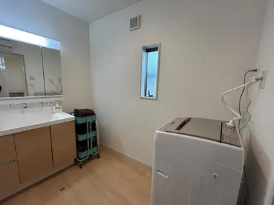 a bathroom with a sink and a washing machine in it at jtr\u58a8\u75303\u4e01\u76ee in Tokyo