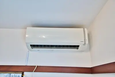 a white air conditioner hanging from a ceiling at Direct Shinjuku Max 10 Tokyo Hostel Shinozaki in Tokyo