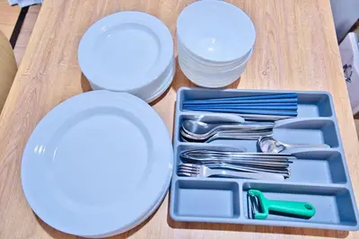a lunch tray with plates and utensils on a table at Direct Shinjuku Max 10 Tokyo Hostel Shinozaki in Tokyo