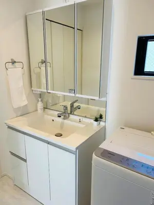 a white bathroom with a sink and a washing machine at A newly built house a 4 minute walk from the station, Free parking & Let's enjoy the night view together! in Tokyo