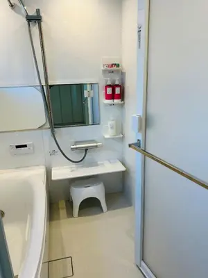 a bathroom with a sink and a mirror at A newly built house a 4 minute walk from the station, Free parking & Let's enjoy the night view together! in Tokyo