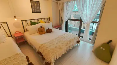 a bedroom with a bed with pumpkins on it at Stunning luxury APT with balcony in Tokyo Shinjuku Kabukicho in Tokyo