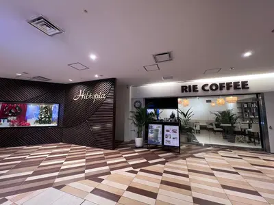 a cafe with a me coffee sign in a lobby at Stunning luxury APT with balcony in Tokyo Shinjuku Kabukicho in Tokyo