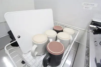 a group of five toilets in a refrigerator at LUANA in SHINJUKU in Tokyo
