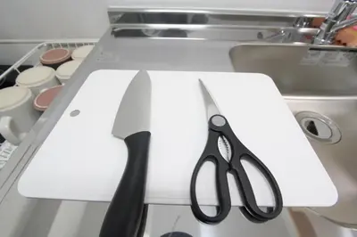 a pair of scissors sitting on top of a counter at LUANA in SHINJUKU in Tokyo