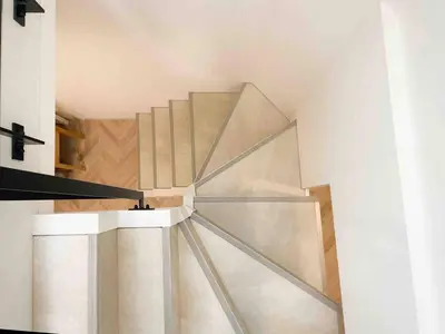 a staircase with a glass railing in a house at ToYo House\u4ee3\u3005\u6728 in Tokyo