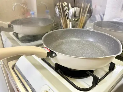 a pan sitting on top of a stove at Shinjuku \u9ad8\u7530\u99ac\u5834T AC in Tokyo