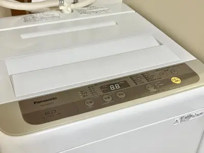a white dishwasher with its door open with a drawer at Shinjuku \u9ad8\u7530\u99ac\u5834T AC in Tokyo
