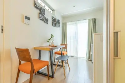 a small kitchen with a table and chairs in a room at DUA \u795e\u697d\u5742Shinjuku area,train 3 mins,waseda,Kagurazaka in Tokyo