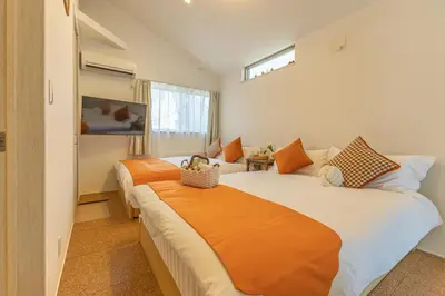 a bedroom with two beds and a window at DUA \u795e\u697d\u5742Shinjuku area,train 3 mins,waseda,Kagurazaka in Tokyo