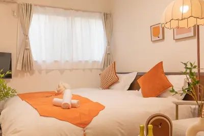 a bedroom with a bed with a stuffed animal on it at DUA \u795e\u697d\u5742Shinjuku area,train 3 mins,waseda,Kagurazaka in Tokyo