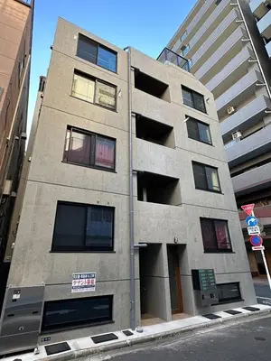 a tall building on the side of a street at jtr\u6d45\u8349\u6a4b502 in Tokyo