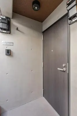 a door in a room with a wall at jtr\u6d45\u8349\u6a4b502 in Tokyo