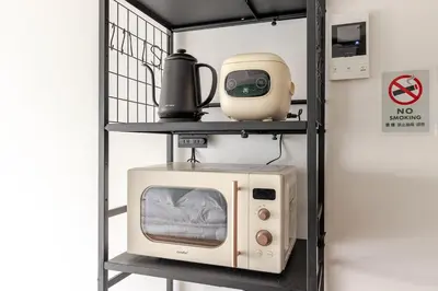 a shelf with a microwave and a no smoking sign at jtr\u6d45\u8349\u6a4b501 in Tokyo