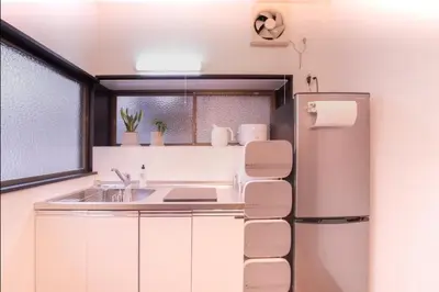 a kitchen with a refrigerator and a sink at \uff26\uff55\uff57\uff41\uff26\uff55\uff57\uff41 in Tokyo