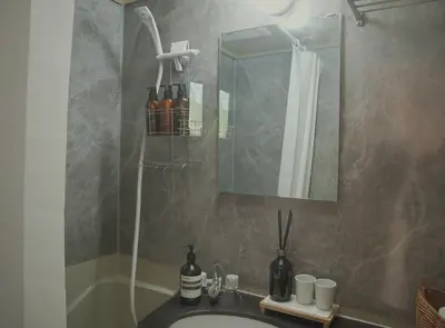 a bathroom with a sink and a mirror and a tub at kikinoie little room \u30c7\u30a3\u30ba\u30cb\u30fc\u30ea\u30be\u30fc\u30c8\u307e\u3067\u8eca\u306715\u5206 in Ichikawa