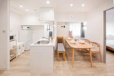 a kitchen and dining room with a table and a sink at self-check in misimaya building in Tokyo