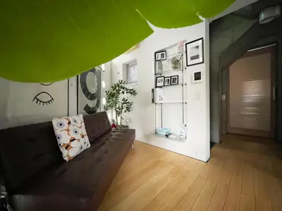 a living room with a brown couch in a room at \u5de3\u9d28Sapmt in Tokyo