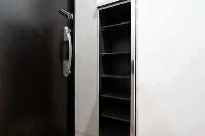 a black refrigerator door with a shelf in it at MAT ARAIYAKUSHI West in Tokyo