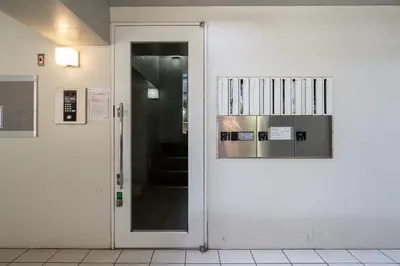 a door with a bunch of books on it at MAT ARAIYAKUSHI West in Tokyo